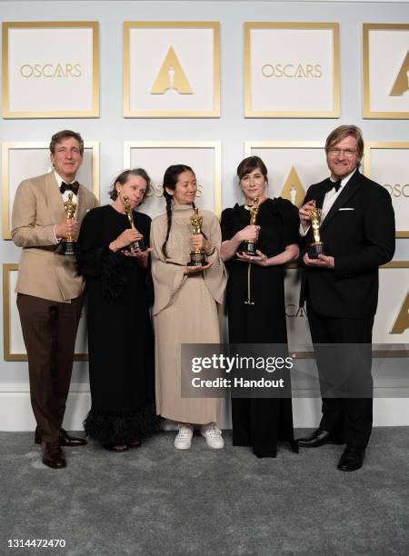 In this handout photo provided by A.M.P.A.S., Peter Spears, Frances McDormand, Chloe Zhao, Mollye Asher, and Dan Janvey, winners of Best Picture for...