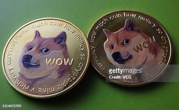 Visual representations of digital cryptocurrencies Dogecoin are seen on April 26, 2021 in Yichang, Hubei Province of China.