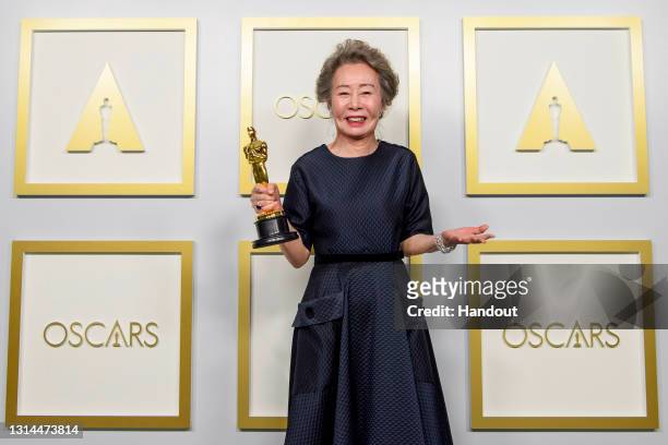 In this handout photo provided by A.M.P.A.S., Yuh-Jung Youn, winner of Best Actress in a Supporting Role for "Minari," poses in the press room during...