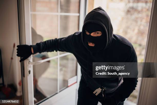 Robber Breaking In 59 Burglar Entering Room Stock Photos, High-Res Pictures, and Images ...