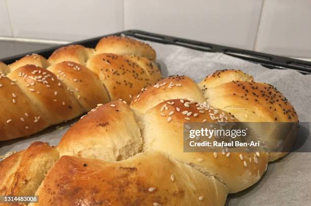 two challah ceremonial bread freshly baked for shabbat - kosher symbol stock pictures, royalty-free photos & images