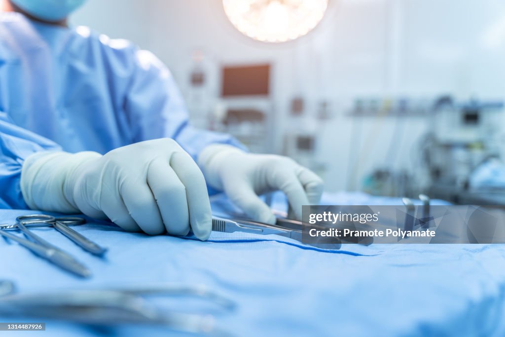Hand Instrument Operative Hand Of Assistant Nurse Hand Taking Surgical Instrument To Surgeons In ...
