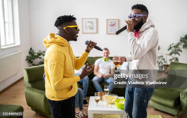 rapper holding microphone photos and premium high res... Rapper Holding Microphone Photos and Premium High Res Pictures - Getty ...