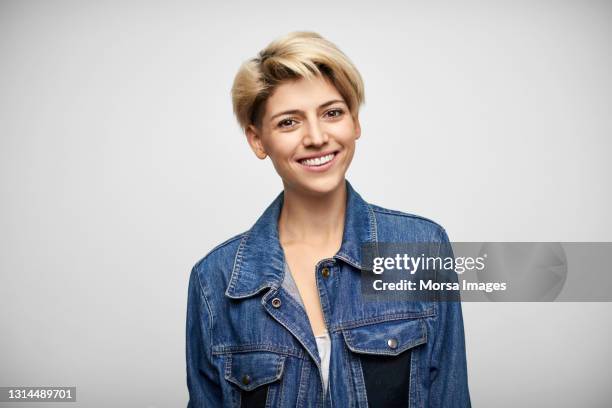 fashionable latin american woman against white background - blue jacket stock pictures, royalty-free photos & images