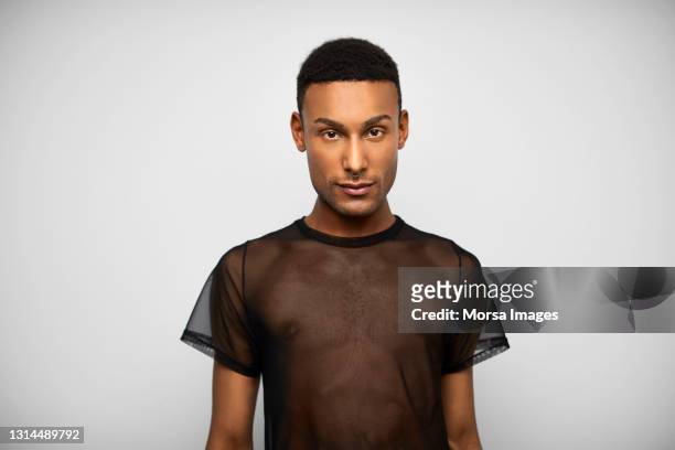 serious latin american man against gray background - gay man bildbanksfoton och bilder