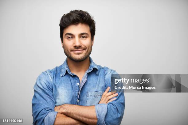 confident latin american man against gray background - hispanic man portrait imagens e fotografias de stock