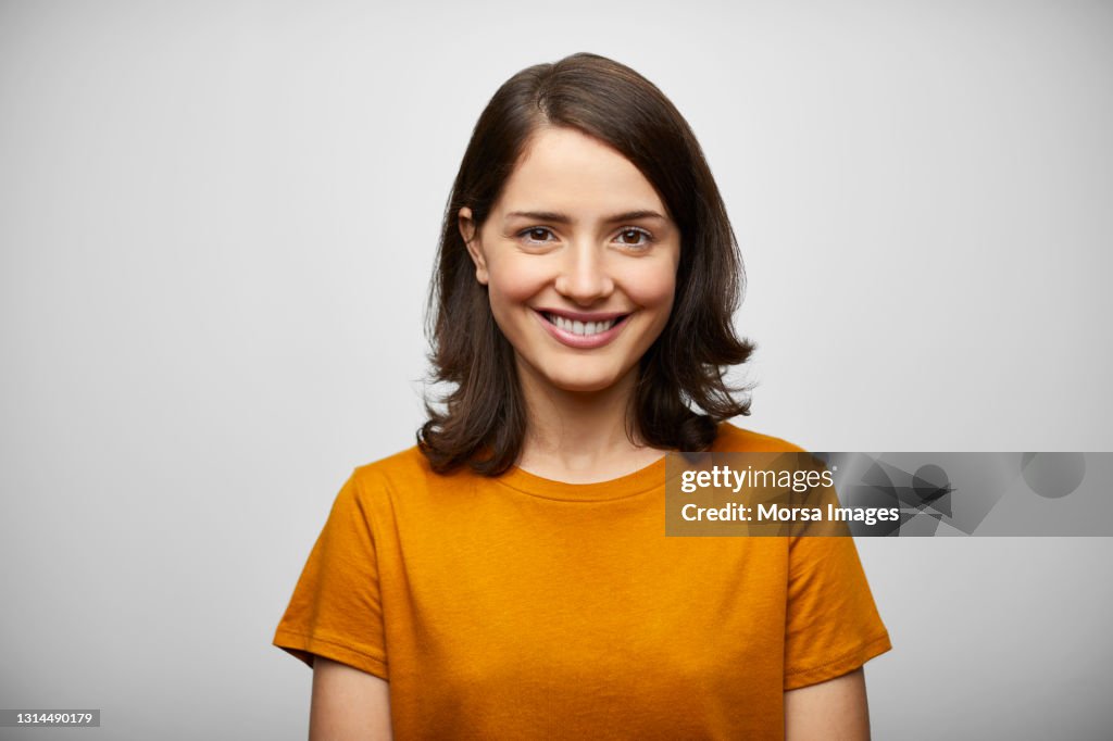 Happy Hispanic Woman Against White Background