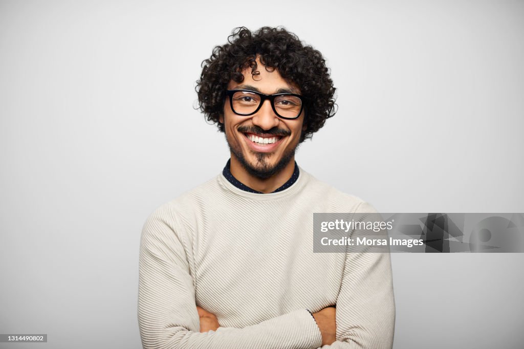 Happy Latin American Man Against White Background