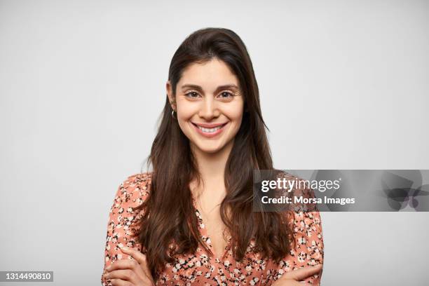 young latin american woman against white background - brown hair isolated stock pictures, royalty-free photos & images