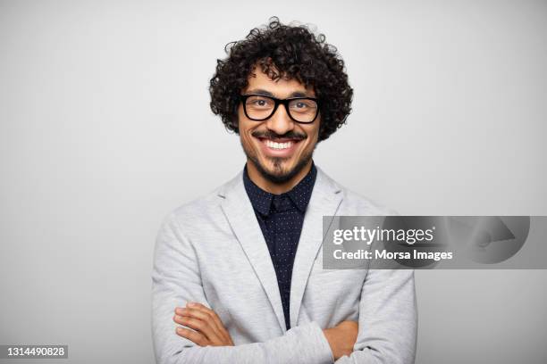 confident latin american businessman against gray background - real businessman isolated no smile stock-fotos und bilder