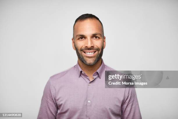 latin american businessman against gray background - male man portrait one person business confident background stock pictures, royalty-free photos & images