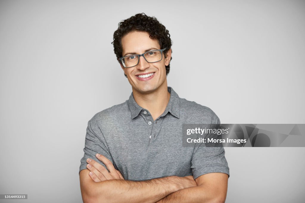 Smiling Young Man Against White Background