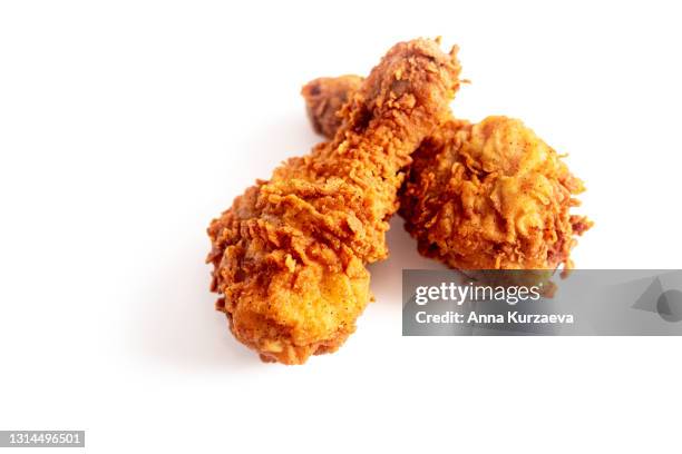 two fried chicken legs isolated on white background - fried chicken white background stock pictures, royalty-free photos & images