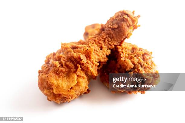 two fried chicken legs isolated on white background - fried chicken stock pictures, royalty-free photos & images