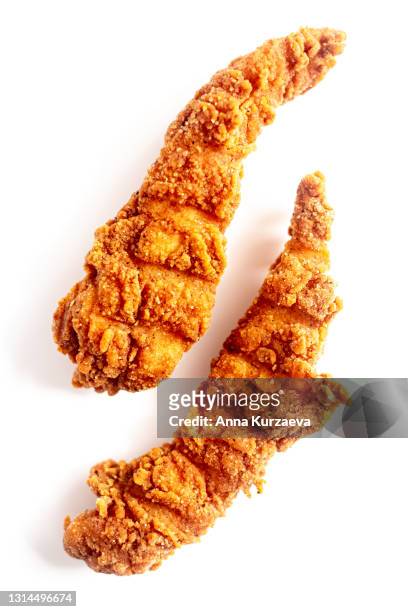 two fried chicken strips isolated on white background - fried chicken white background stock pictures, royalty-free photos & images