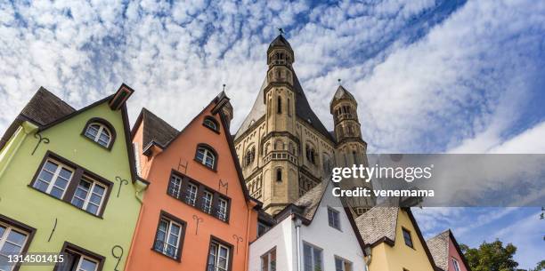 Panorama of colorful old houses and church tower at the fish market square in Koln