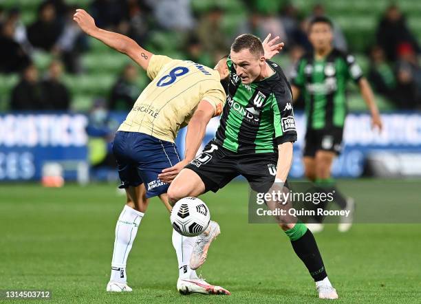 Besart Berisha of Western United controls the ball past Liridon Krasniqi of the Jets during the A-League match between Western United and the...