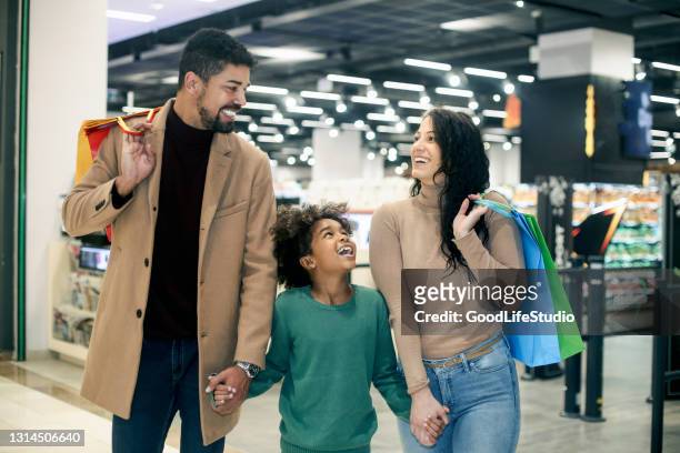 family in a supermarket - couple shopping in shopping mall stock pictures, royalty-free photos & images
