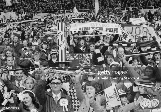 Newcastle United fans during the FA Cup final between Liverpool and Newcastle United at Wembley Stadium in London, UK, 4th May 1974. The score was a...