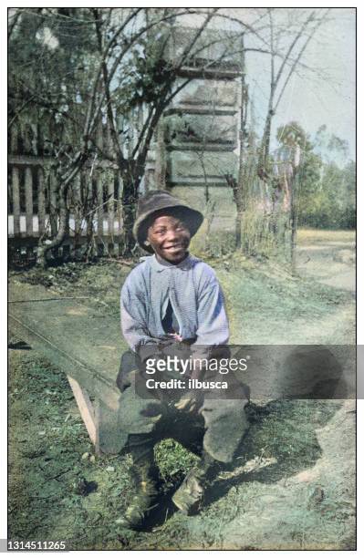 illustrazioni stock, clip art, cartoni animati e icone di tendenza di foto antica colorizzata degli stati uniti: happy boy - popolo di discendenza africana