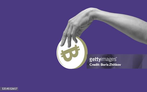 hand holding bitcoin - bitcoin stock pictures, royalty-free photos & images