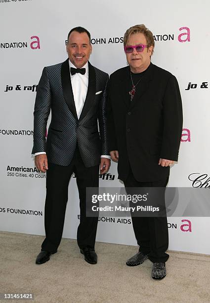 David Furnish and musician Sir Elton John attend the 19th Annual Elton John AIDS Foundation's Oscar viewing party held at the Pacific Design Center...