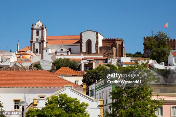 townscape with cathedral, silves, algarve, portugal - silves portugal stock pictures, royalty-free photos & images