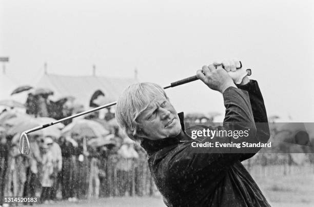 American golfer Jack Nicklaus playing in the rain during the 1973 Open Championship at Troon in Scotland, UK, July 1973.