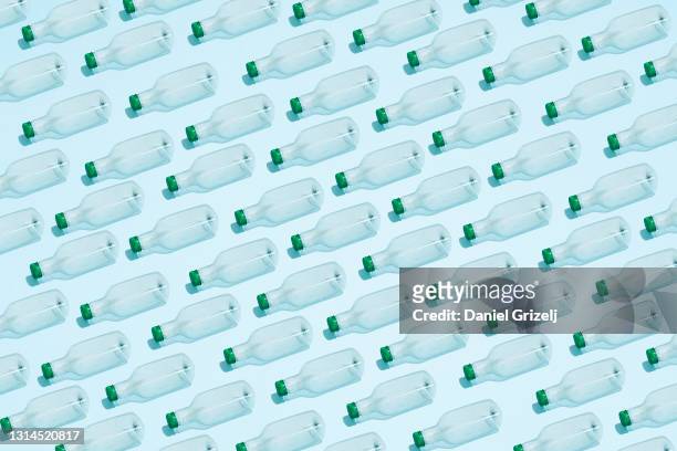 pet bottles placed in a row - arranging stock-fotos und bilder
