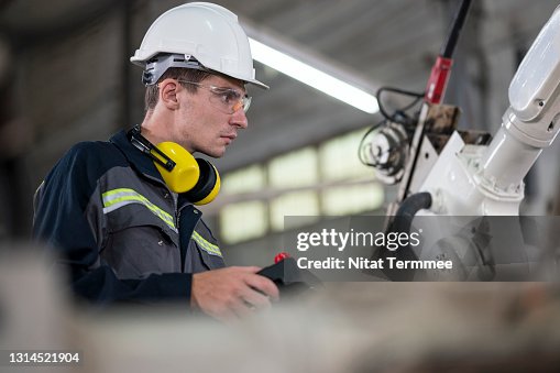 Torch Engineer Welding Engineer Using Remote Controller To Operate Robotic Arm Welding ...