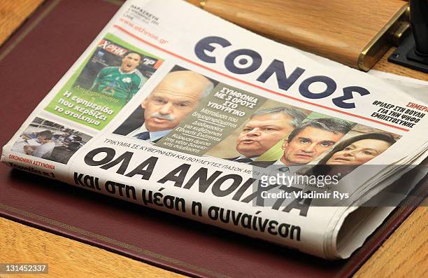 Ethnos Newspaper with the headline "Everything is open" sits on the table in the Greek parliament ahead of the confidence vote for the government of...