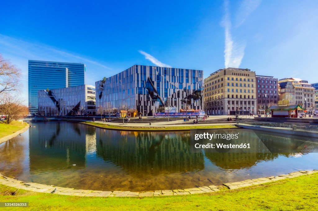 Germany, Dusseldorf, Architecture reflecting in water