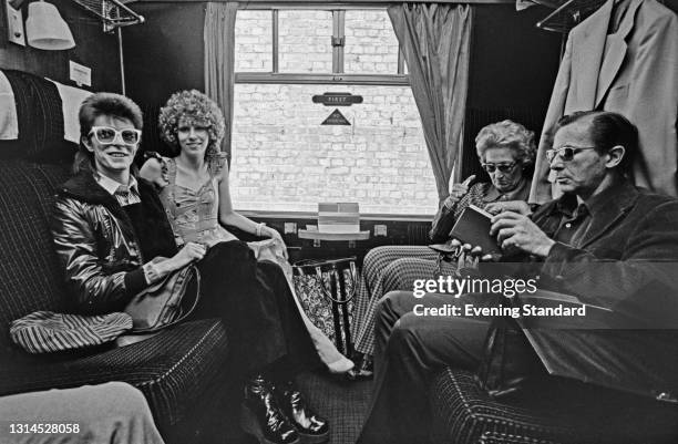 English singer and actor David Bowie travels to France from Victoria Station in London, with his wife Angie Bowie, UK, 9th July 1973.