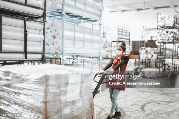 Person Pushing Garment Rack Face Pushing Through Fabric Photos and Premium High Res Pictures ...
