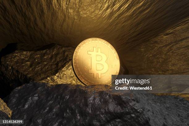 three dimensional render of bitcoin shining inside mine - bitcoin stock-grafiken, -clipart, -cartoons und -symbole