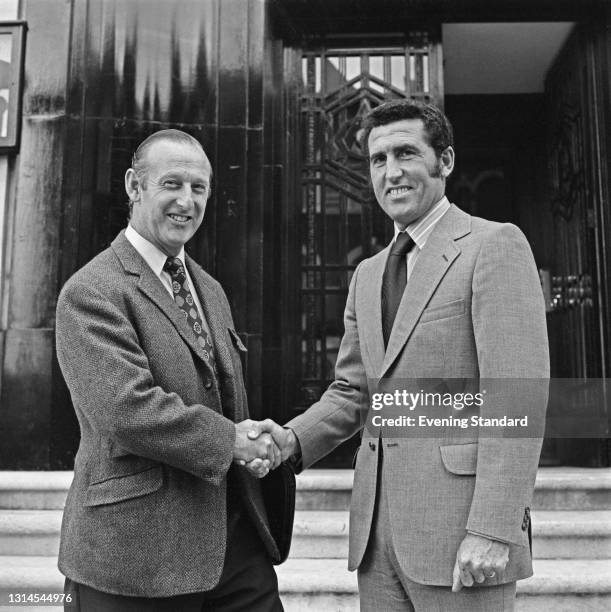 Bertie Mee , manager of Arsenal FC, shakes hands with new Arsenal coach Bobby Campbell , London, UK, 17th September 1973.