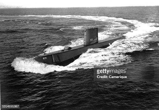 Submarine either getting ready to dive or just surfacing. Circa 1965