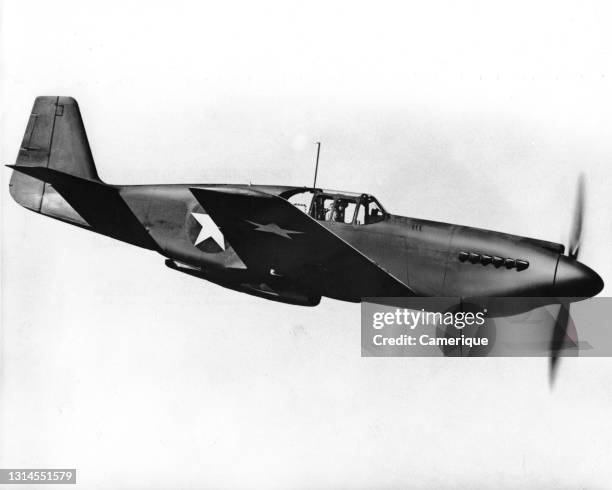 Mustang aircraft flying along in horizontal attitude. Circa 1944