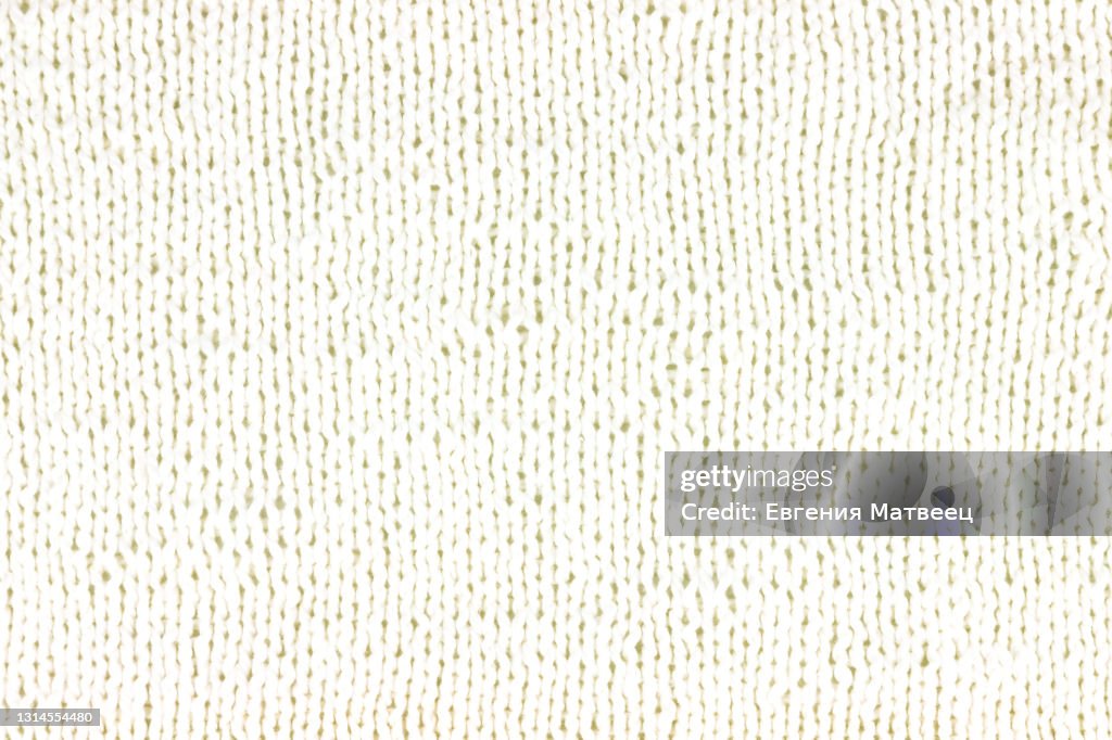 White knitted wool background texture. Knitting concept.