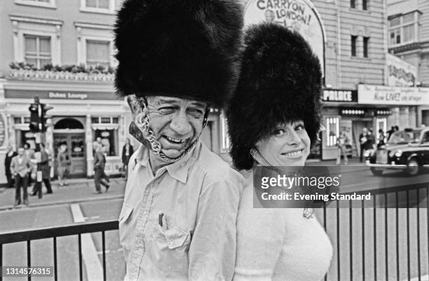 English comedy actors Sid James and Barbara Windsor star in the stage show 'Carry On London!' at the Victoria Palace Theatre in London, UK, 17th...