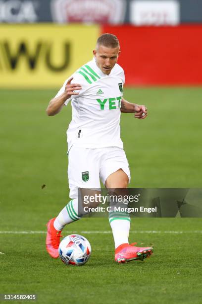 Alexander Ring of Austin FC kicks the ball against the Colorado Rapids during the first half at Dick's Sporting Goods Park on April 24, 2021 in...