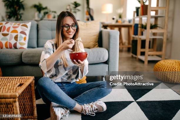 woman eating spaghetti bolognese - the joys of eating spaghetti stock pictures, royalty-free photos & images