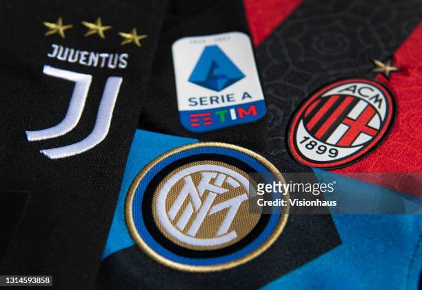 The Inter Milan badge with the Serie A logo and the Juventus and AC Milan badges on their first team home shirts on April 26, 2021 in Manchester,...