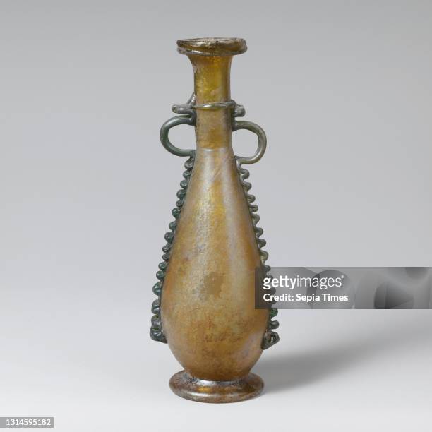 Glass flask, Late Imperial, 4th century A.D., Roman, Syrian, Glass; blown, tooled, and trailed, H. 7 13/16 in. , Glass, Translucent yellow green;...
