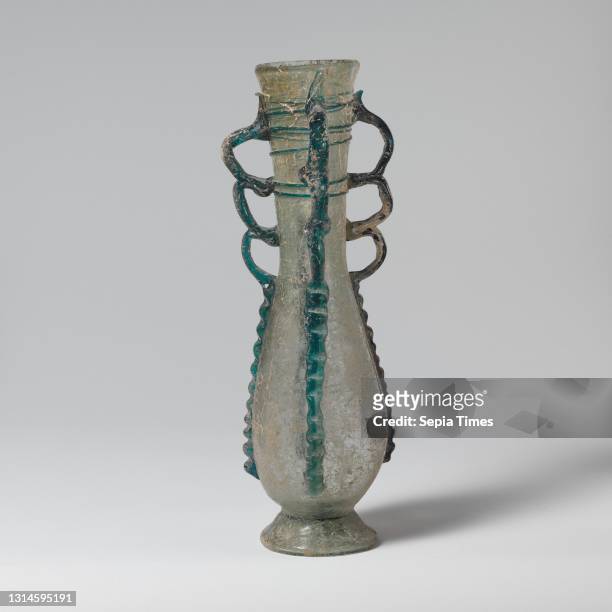 Glass flask, Late Imperial or Early Byzantine, 4th–6th century A.D., Roman, Syrian, Glass; blown and trailed, H. 8 1/16 in. , Glass, Translucent pale...
