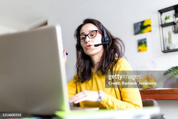 teacher woman teaching remotely from home - professor glasses stock pictures, royalty-free photos & images