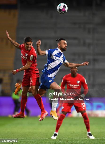 Cristian Gamboa of VfL Bochum 1848 battling for the header with Serdar Dursun of SV Darmstadt 98 during the Second Bundesliga match between SV...