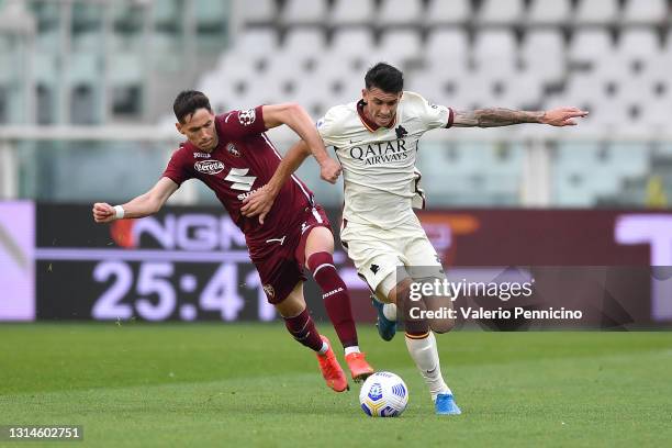 Sasa Lukic of Torino FC competes with Roger Ibanez of AS Roma during the Serie A match between Torino FC and AS Roma at Stadio Olimpico di Torino on...