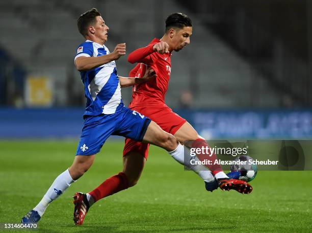 Nicolai Rapp of SV Darmstadt 98 tackles Robert Zulj of VfL Bochum 1848 during the Second Bundesliga match between SV Darmstadt 98 and VfL Bochum 1848...