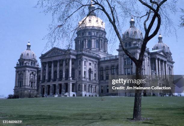 35mm film photo shows the Iowa State Capitol from a distance. A rolling green lawn surrounds the building and trees are scattered throughout, 1941.